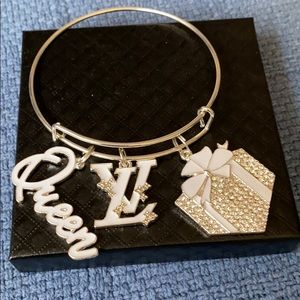 Silver plated bangle with charms